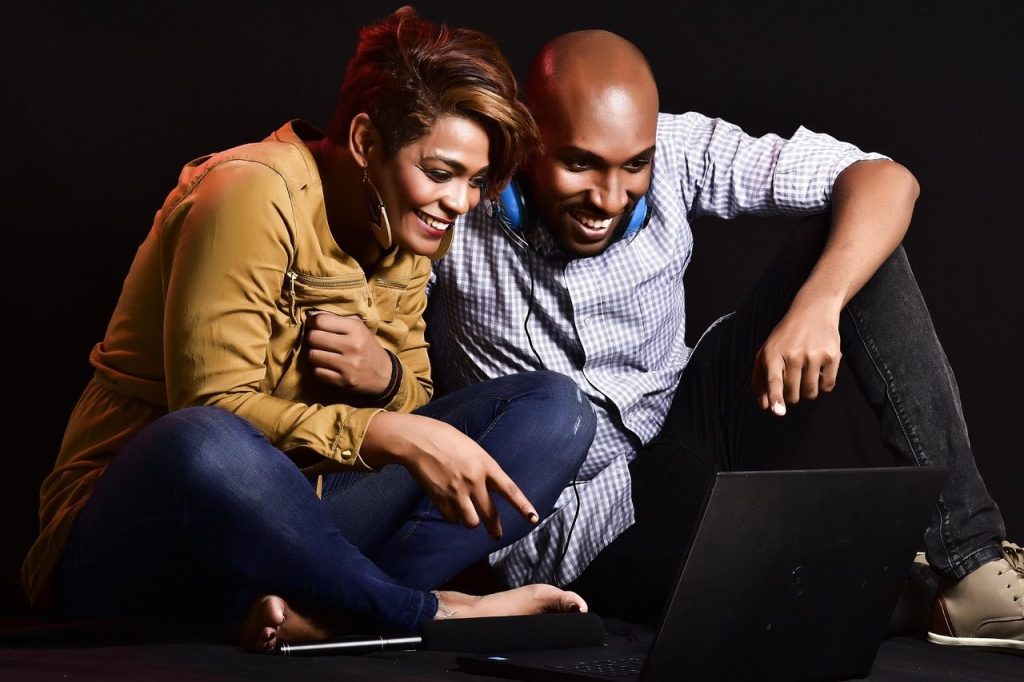 adult, couple, woman, man, fun, enjoyment, notebook, media, watching tv, laughing, funny, happy, black people, ai generated