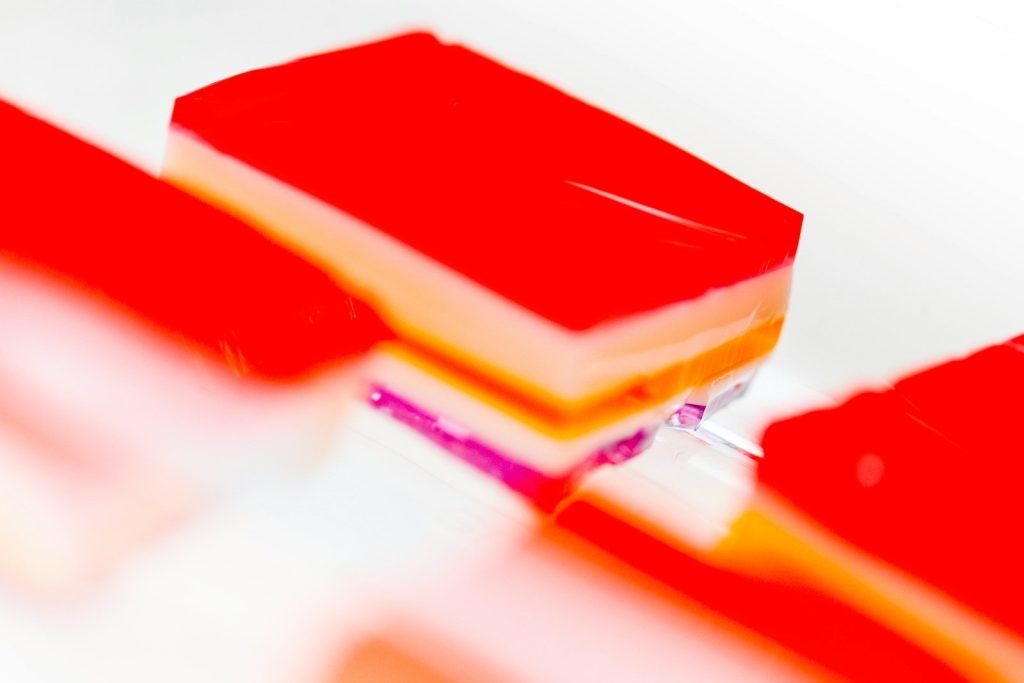 red and yellow cake on white surface