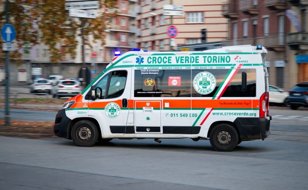 Ambulance driving down a city street