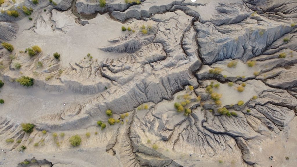 Aerial shot capturing the rugged terrain of Konduki, Russia, showcasing dry land formations.