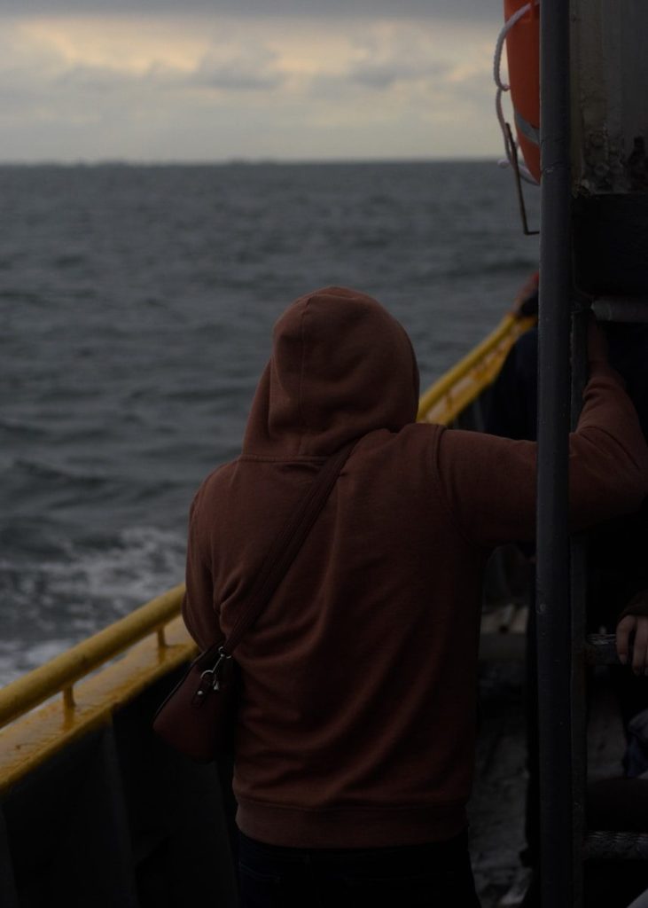A couple of people that are on a boat