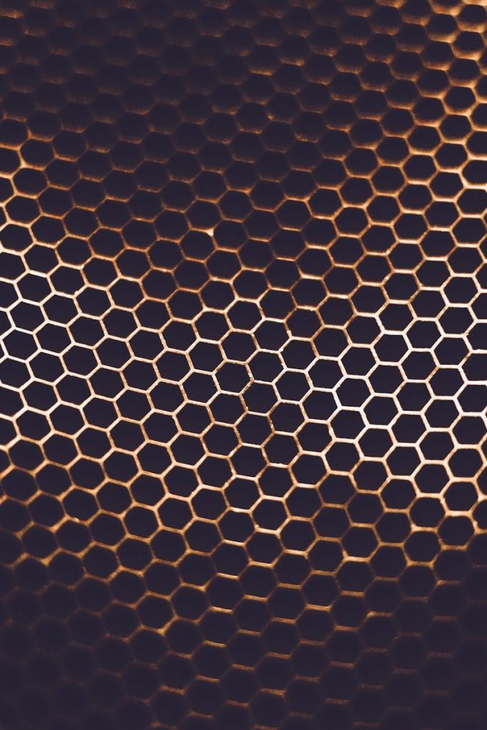 a close up of a honeycomb pattern on a cell phone